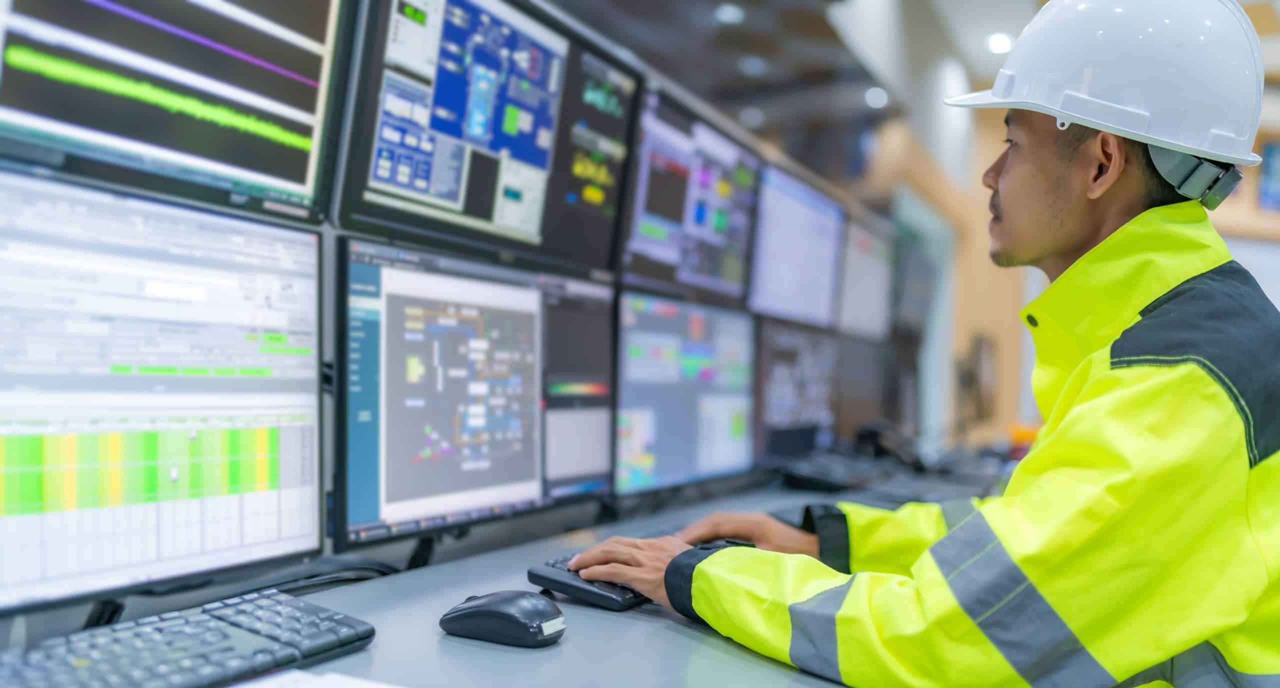 Engineer working at control room,Manager control system,Technician man monitoring program from a lot of monitor